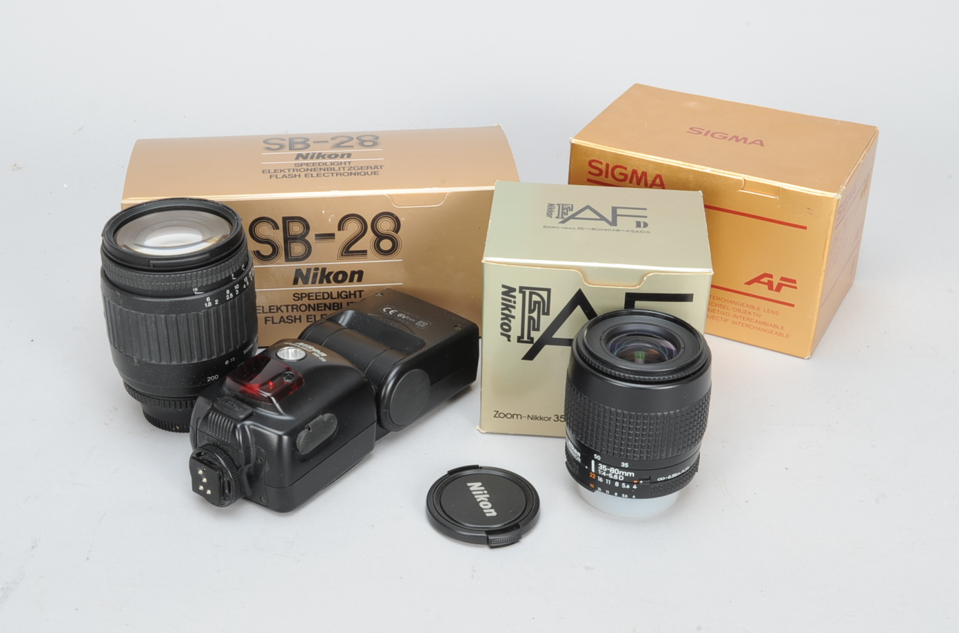 Nikon and Sigma Zoom Lenses and a Nikon Speedlight SB-28, an AF-Nikkor, 35-80mm f/4-5.6D lens, G,