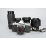 An Asahi Pentax K1000 SLR Camera and Lenses, chrome, shutter working, meter responds to light,