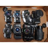 A Group of 35mm SLR Cameras, A Canon T80 camera with Canon AC 35-70mm and 75-200mm autofocus lenses,