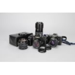 A Minolta 9000 and a Minolta 7000 AF SLR Cameras and Lenses Outfit, 9000 camera, black, serial no