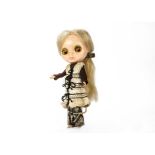 A Kenner Blythe multi-eyed doll, With blonde hair, four different eye colours and original outfit —