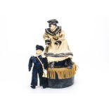 A modern 19th century style automaton of a sailor girl, Sat on a cylindrical base with music