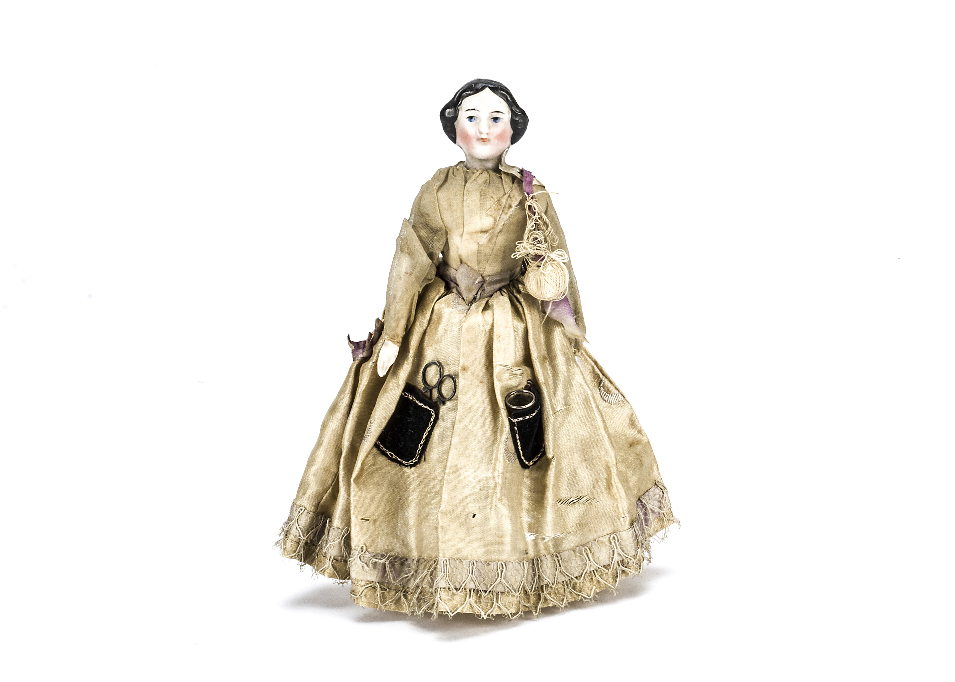 A large scale china shoulder-head dolls’ house doll, With black centre-parted moulded and painted