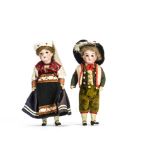 A Gerbruder Kuhnlenz boy and girl doll, With fixed dark eyes, the girl with light brown wig, the boy