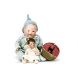 Two bisque headed baby dolls, One marked 50 with blue painted eyes, open/closed mouth, brown