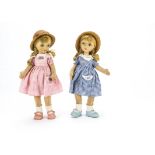 Two larger Old Cottage Dolls, With rubber heads, blonde plaited wigs, felt bodies, gingham