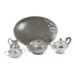 A 1950s Arts & Crafts-style hammered pewter tea service, by Walker and Hall Howard Pewter,