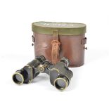 A pair of WWI military binoculars by G Fournier of Paris, in a brown leather case marked '143142.5'