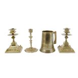 A collection of metalware, including a pair of brass candlesticks, square and octagonal knopped