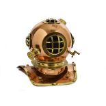 A reproduction copper and brass diving helmet, 39 cm high