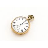 An early 20th century 14ct gold cased open faced pocket watch, 46mm case with top winder, base metal