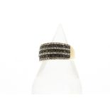 A 9ct gold seven band black and white diamond half hoop dress ring, the alternate bands of black and