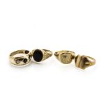 Four 9ct gold gentleman's rings, including two gold signets, an onyx example and a gem set