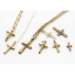 A collection of mostly gold crosses and crucifixes, three on chains, total gold weight 17g