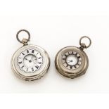 Two late 19th century continental silver half hunter pocket watches, both with blue enamel roman