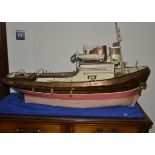 A large scale model of an Ocean Going Tug, metal hull with wooden deck and wood and metal