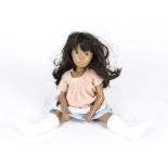 A Trendon Sasha Doll, with long dark hair, non-original wool and cotton smock and probably