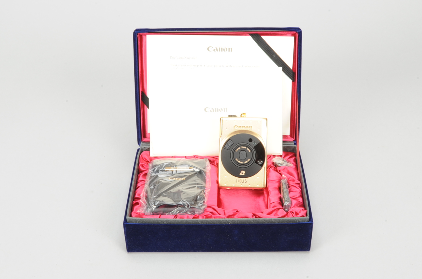 A 60 ?? Anniversary Canon Ixus Elph Advanced Camera, limited edition serial no 009173, gold