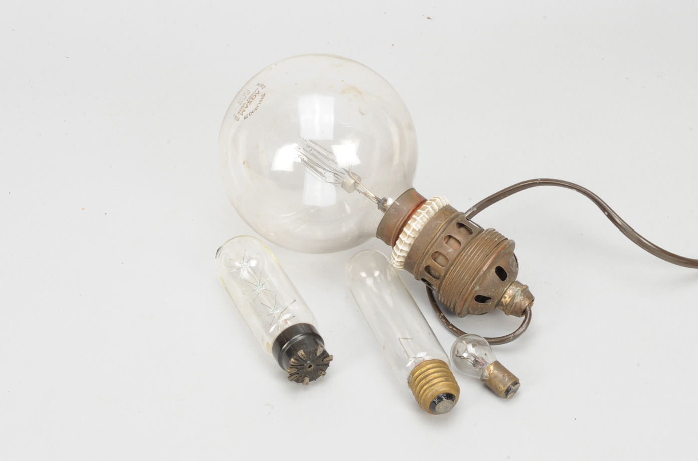 A Mazda 1000 watts Studio Floodlight, a 260 volts incandescent spherical glass bulb, filament