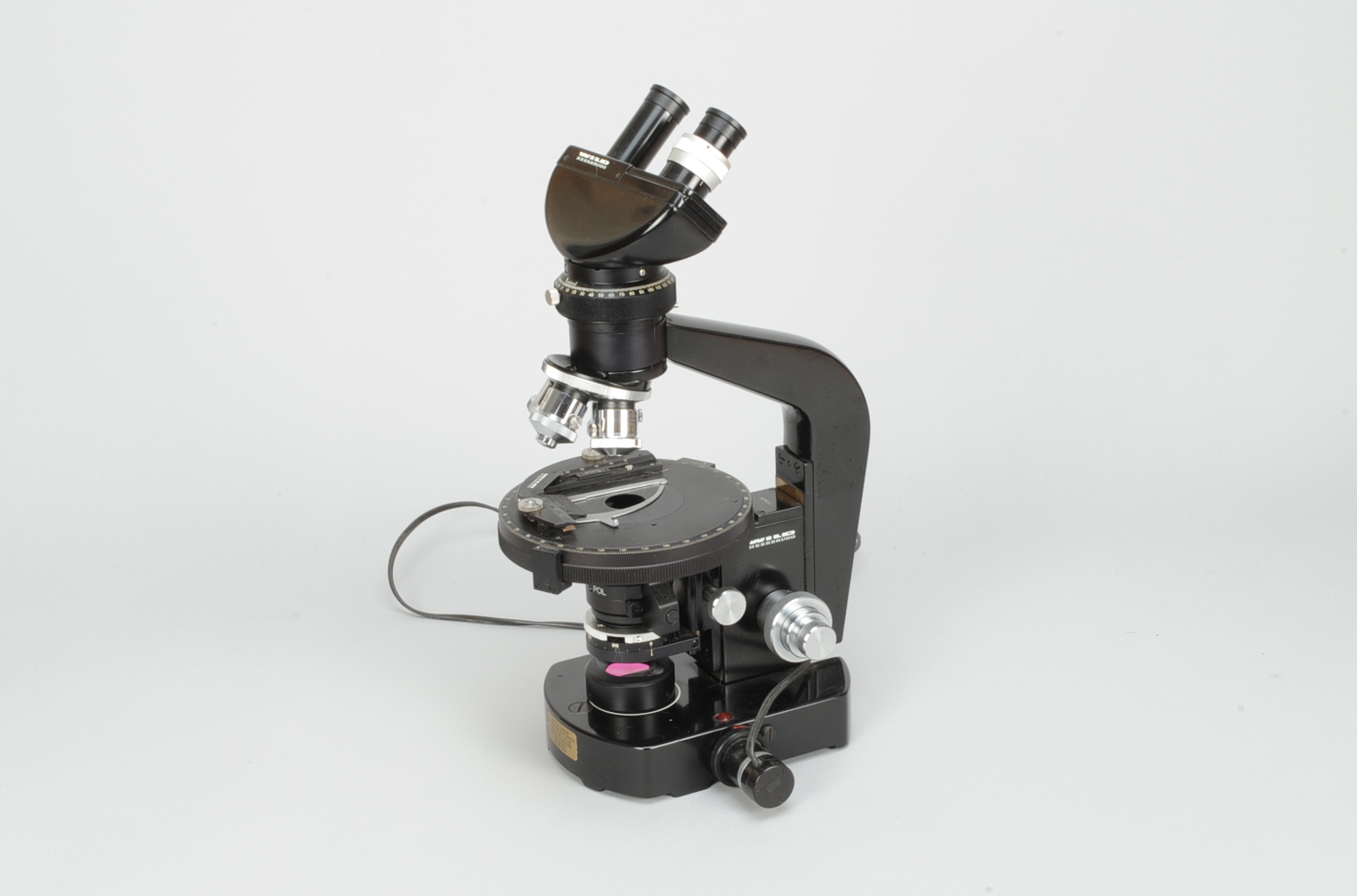 A 20th Century black-enamelled Wild M21 Polarising Binocular Microscope, serial no. 112028, with
