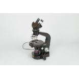 A 20th Century black-enamelled Wild M21 Polarising Binocular Microscope, serial no. 112028, with