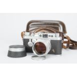 A Leica IIIg Camera, serial no. 887142, 1957, factory conversion from Ig, body F-G, nick in front