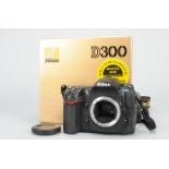 A Nikon D300 DSLR Camera Body, serial no 8027853, powers up, shutter working, body G, in maker's