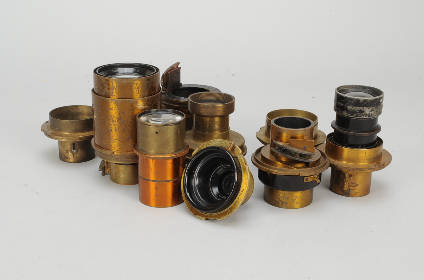 A Wooden Case of Cinematographer's Lenses, a group of 1930s brass mounted lenses in a felt-lined,