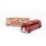 A Mettoy Streamline Bus, red body, clockwork mechanism, pressed tin seating, rubber wheels, in