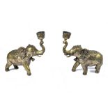 A pair of late 19th Century Anglo Indian cast brass candlesticks, modelled as elephants with