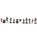 A 20th Century chess set, the lead figures modelled as African tribal figures, complete, king 9 cm