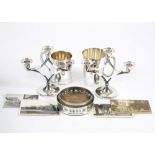 A pair of silver plate candlesticks,18 cm high, two flagon's, two ashtrays and a boxed Stratton