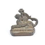 A Victorian cast iron doorstop, modelled as a winged lion, height 17 cm