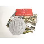 A GWR Enamel Sign Publicity Photographs and Repro Coat of Arms, the sign in white on red 'GWR