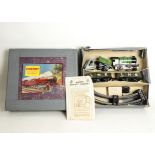 A Hornby O Gauge Clockwork M1 Goods Set, locomotive in green no 3435, with two LNE grey open wagons,