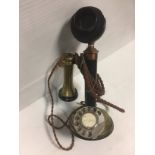 An Edwardian era brass and blacked candlestick, GPO telephone model S234 number 22, height 33 cm