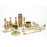 A selection of 20th Century brassware, including a pair of candlesticks, empty shell cases including