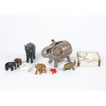 A collection of animal models, comprising numerous elephants in ebony, glass, hardstone and brass, a