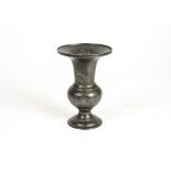 A 19th Century Middle Eastern pewter vase and cover, decorated with bands of birds and foliage,