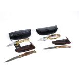 Two Laguiole pocket knives, with wooden handles and an imprint of a bee, stainless steel blades, one