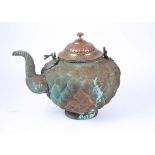 A large Indo Persian copper kettle, decorated with a chased exterior and scrolling handles,