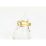 An 18ct gold diamond set gentleman's signet ring, the brilliant cut diamond with large fracture to