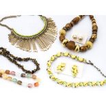 A large quantity of costume jewellery, including simulated pearls, white metal cuff bangles,