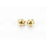 A pair of continental yellow metal and diamond set stud earrings, the cabochon shaped studs with