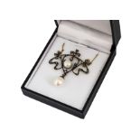 A cultured pearl and diamond art nouveau style pendant, the whiplash styled diamond set mount