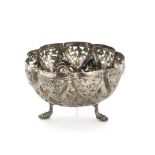 An early 20th century Indian silver bowl, ornately decorated with raised designs and pierced