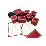 A collection of red leather Cartier boxes, including a card Cartier box and a suede Tiffany box (11)