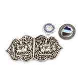 A vintage Indian silver nurse's belt buckle, together with two nurse's badges (4)