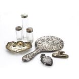 A Victorian silver hand mirror, together with a silver scent bottle holder lacking its bottle, a