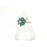 A 9ct gold turquoise cluster ring, the claw set cabochon gems in plain gold shank, 3.8g, ring size L
